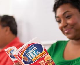 woman reading a calorie book